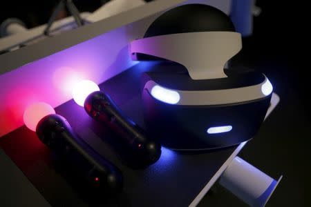 Sony's Project Morpheus "London Heist" video game virtual reality headset and move controllers are seen at the Sony PlayStation booth at the Electronic Entertainment Expo, or E3, in Los Angeles, California, United States, June 16, 2015. REUTERS/Lucy Nicholson