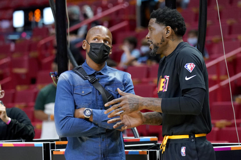 Former Miami Heat player Ray Allen, left, talks with Miami Heat forward Udonis Haslem before an NBA basketball game against the Utah Jazz, Saturday, Nov. 6, 2021, in Miami. (AP Photo/Lynne Sladky)