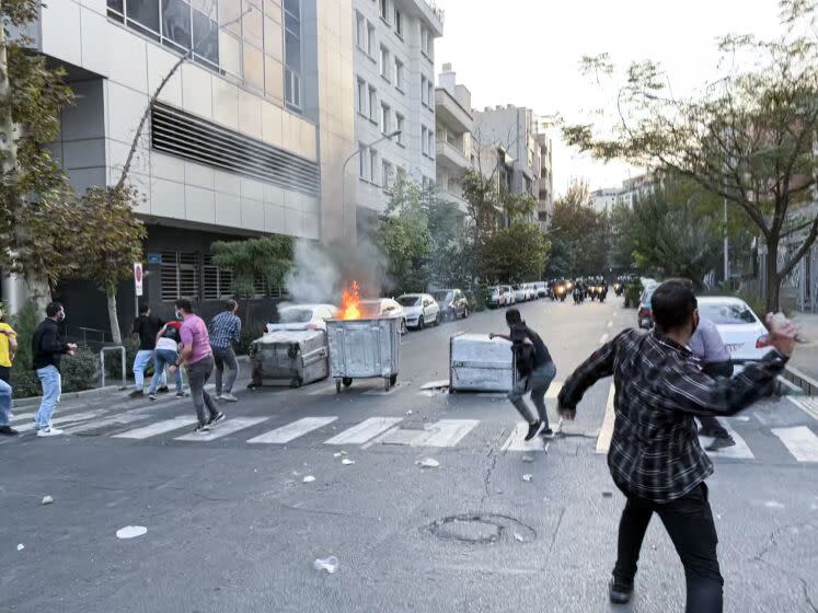 TEHRAN, IRAN - SEPTEMBER 20: People gather during a protest for Mahsa Amini, who died after being arrested by morality police allegedly not complying with strict dress code in Tehran, Iran on September 20, 2022. (Photo by Stringer/Anadolu Agency via Getty Images)