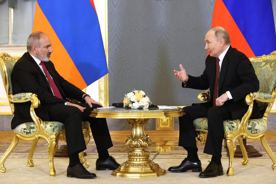 Russian President Vladimir Putin, right, gestures while speaking to Armenian Prime Minister Nikol Pashinyan on the sidelines of a meeting of the Eurasian Economic Union at the Kremlin in Moscow, Russia, on Wednesday, May 8, 2024. Russian President Vladimir Putin hailed the economic alliance's performance, saying that it helped boost the members' economic potential. (Alexander Shcherbak, Sputnik, Kremlin Pool Photo via AP)