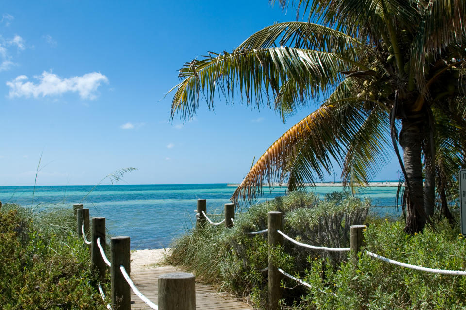 a path leading a a beach in key west, florida