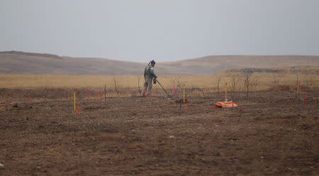 A member of a demining team searches for landmines in Khazer, Iraq December 1, 2016. Picture taken December 1, 2016. REUTERS/Khalid al Mousily