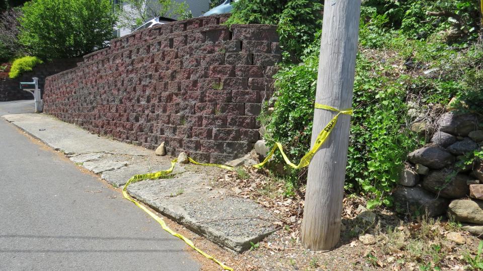 Police tape is left on Chestnut Hill Drive East in the Indian Lake section of Denville after authorities investigated the death of a woman there May 18, 2021.