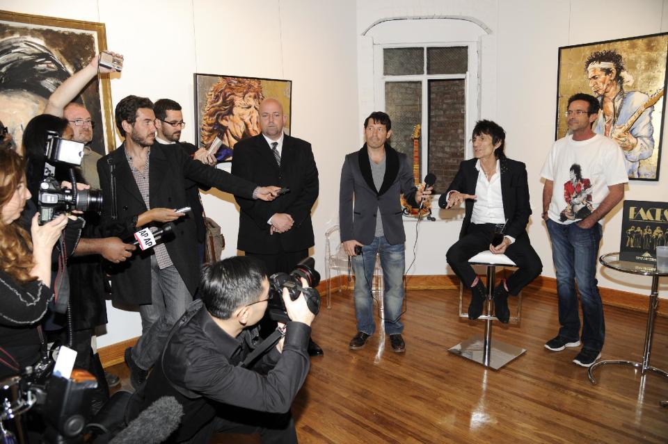 Rolling Stones guitarist Ronnie Wood speaks to reporters during a news conference unveiling his new art exhibit "Faces, Time and Places" on Monday, April 9, 2012, in New York. (AP Photo/Evan Agostini)