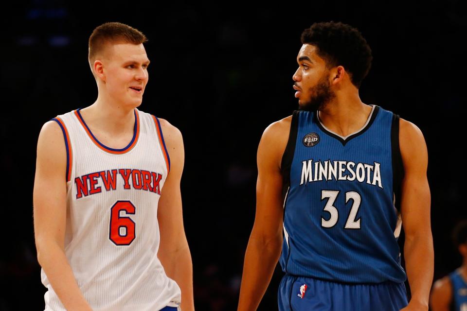 Kristaps Porzingis and Karl-Anthony Towns argue over which one gets to be called 'El Chupacabra.' (Getty Images)