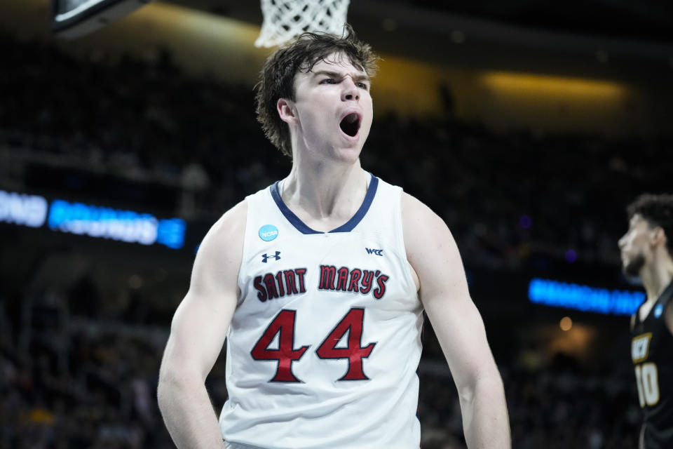 St. Mary's Alex Ducas (44) reacts after scoring in the second half of a first-round college basketball game against Virginia Commonwealth in the NCAA Tournament, Friday, March 17, 2023, in Albany, N.Y. (AP Photo/John Minchillo)