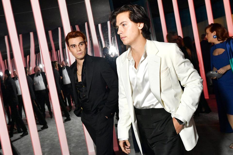 ...While their costars KJ Apa and Cole Sprouse look calm, cool and collected. 