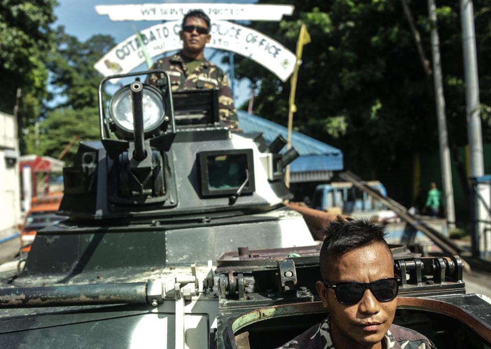 Filipino soldiers man a military armoured personnel carrier on a street following President Rodrigo Duterte's declaration of Martial law in Cotabato City, Mindanao Island, southern Philippines