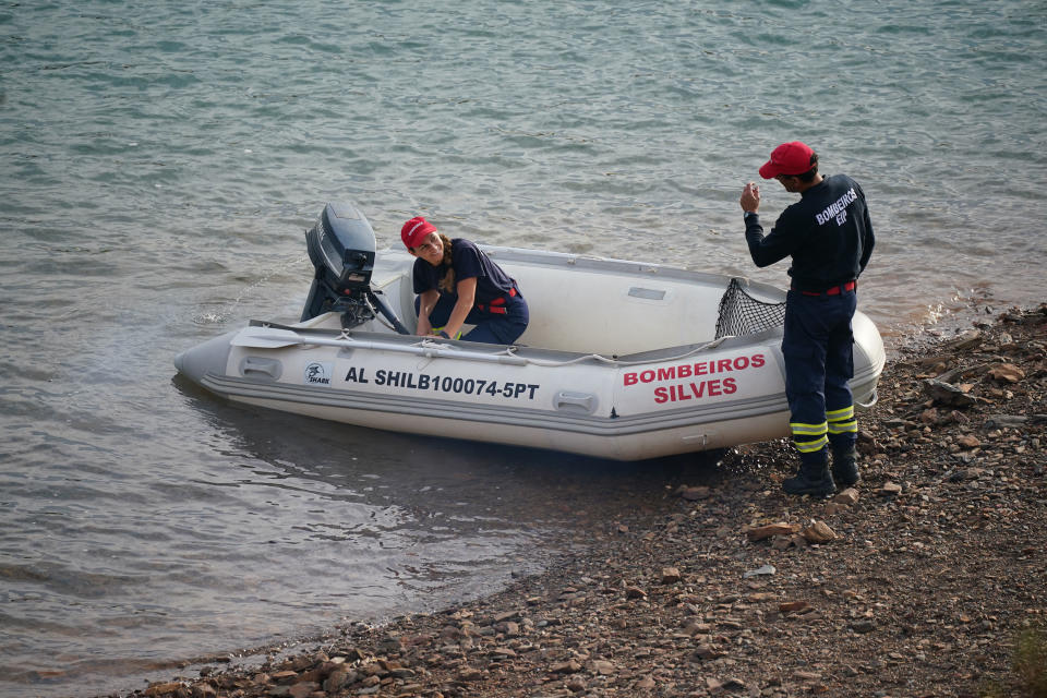 Personnel at Barragem do Arade reservoir, in the Algave, Portugal, as searches begin as part of the investigation into the disappearance of Madeleine McCann. The area is around 50km from Praia da Luz where Madeleine went missing in 2007. Picture date: Tuesday May 23, 2023. PA Photo. See PA story POLICE Portugal. Photo credit should read: Yui Mok/PA Wire 