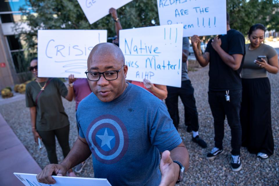 Marlo Watkins, a provider with Health & Harmony, attends a rally outside the Arizona Department of Health Services in Phoenix on Sept. 26, 2023.
