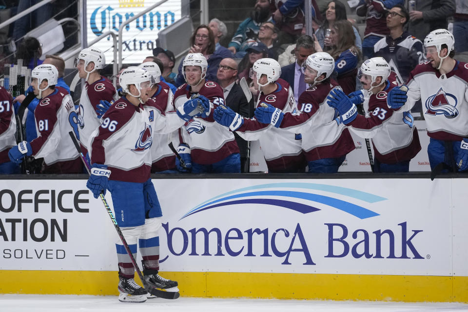 Colorado Avalanche right wing Mikko Rantanen (96) is congratulated for his goal against the San Jose Sharks during the first period of an NHL hockey game in San Jose, Calif., Thursday, April 6, 2023. (AP Photo/Godofredo A. Vásquez)