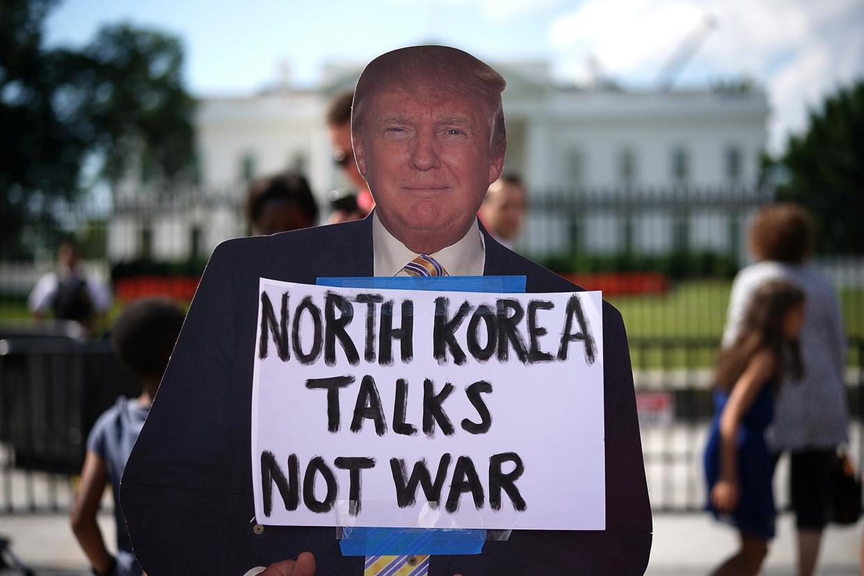 A cardboard cutout of US President Donald Trump is shown during a protest against escalating threats of military action in North Korea: Win McNamee/Getty Images