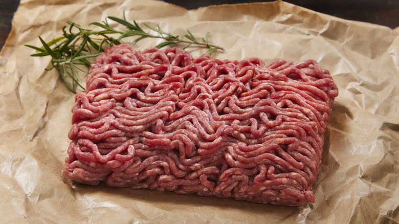 raw ground beef with rosemary