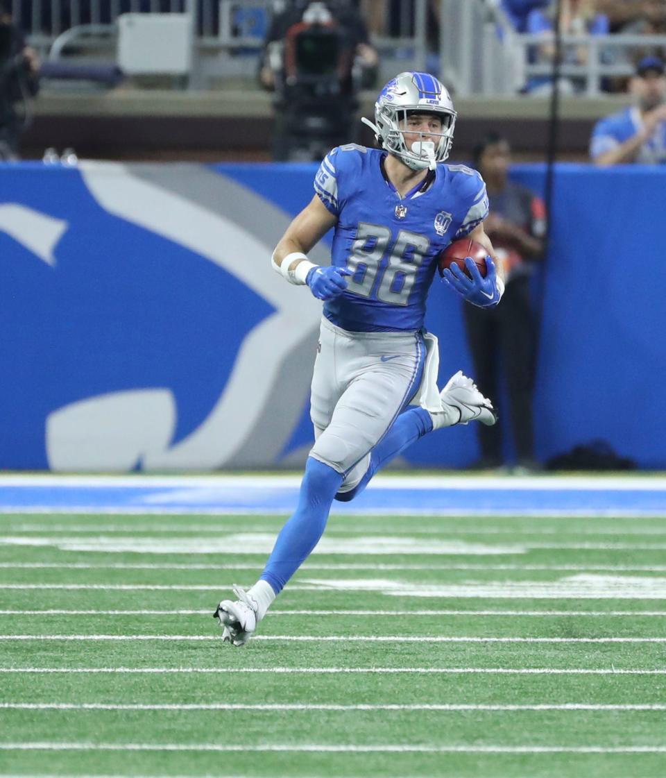 Detroit Lions wide receiver Chase Cota (88) runs back a punt during first action against the Jacksonville Jaguars during first half Saturday, August 19, 2023.