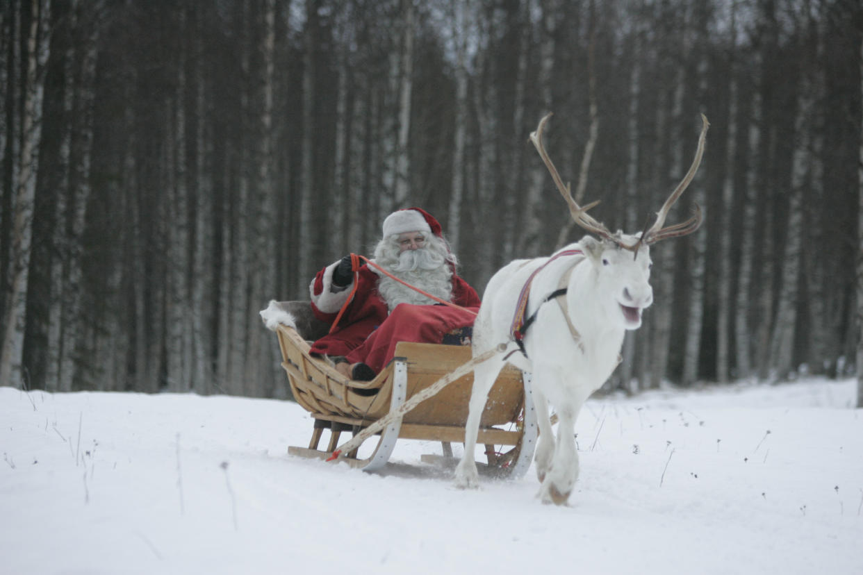 A man dressed as Santa Claus rides his sleigh as he prepares for Christmas on the Arctic Circle in Rovaniemi, northern Finland, December 19,2007. REUTERS/KACPER PEMPEL (FINLAND)   BEST QUALITY AVAILABLE