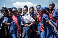 <p>Members of Kenya Girl Guides take photos after attending ceremony of the International Women’s Day at Kawangware in Nairobi, Kenya, on March 8, 2018.(Photo: Yasuyoshi Chiba/AFP/Getty Images) </p>