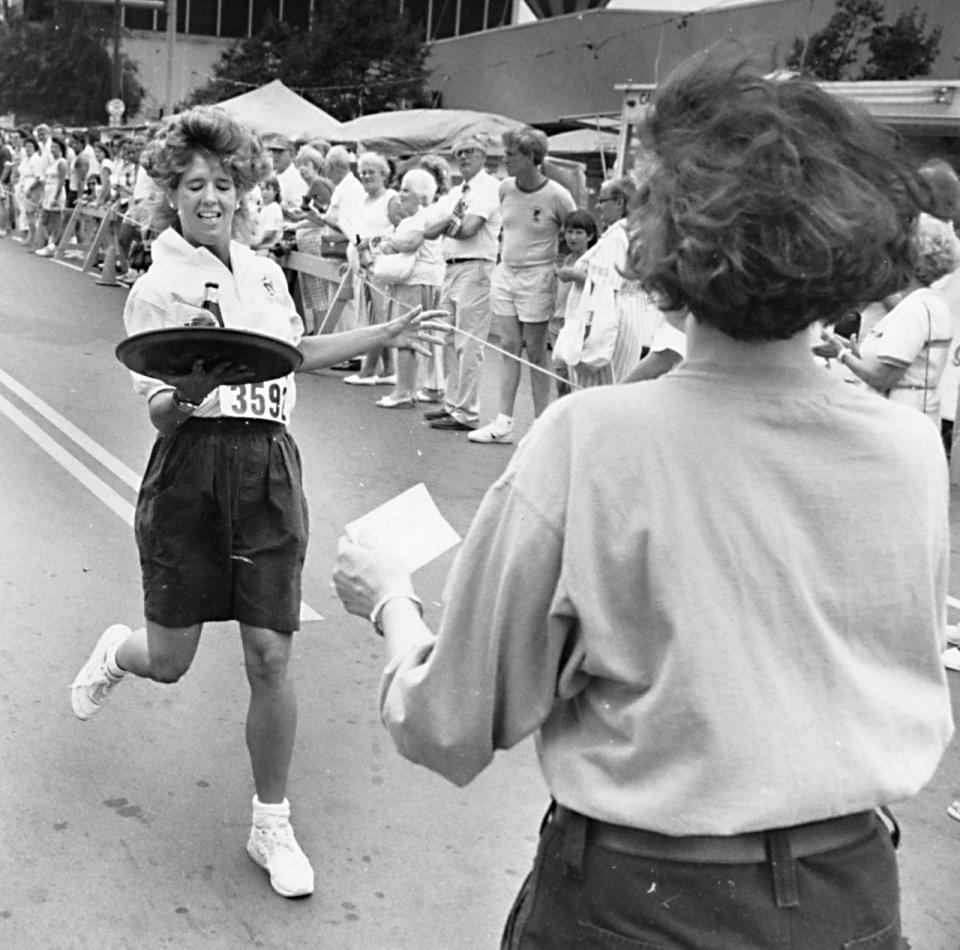 Marie McNamara, of the Red Lion Pub in Clinton, was greeted at the finish line by a volunteer during the race for area waiters and waitresses in 1989. She won the race’s women’s division.