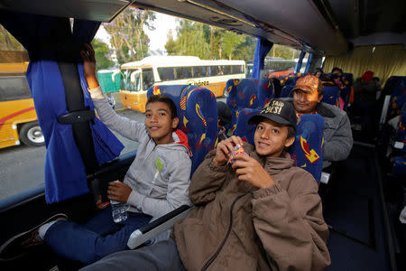 Central American migrants, part of a caravan moving through Mexico, are seen in a bus bound to Mexico City, in Puebla, Mexico April 9, 2018. REUTERS/Imelda Medina