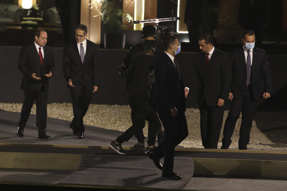 Egypt's President Abdel Fattah al-Sisi and Tourism and Antiquities Minister Khaled el-Enany attend the official ceremony of the opening of the Avenue of Sphinxes commonly known as El Kebbash Road on Thursday, Nov. 25, 2021 in Luxor, Egypt. The ceremony was meant to highlight the country’s archaeological treasures as Egypt struggles to revive its tourism industry, battered by years of political turmoil and more lately, the coronavirus pandemic. (AP Photo/Mohamed El-Shahed)