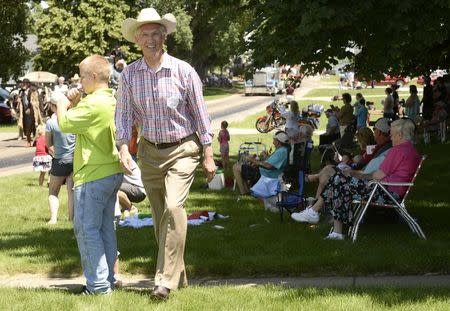 Democratic Senate candidate Dave Domina walks a parade route to meet prospective voters in the town of Elgin, Nebraska June 22, 2014. REUTERS/Darin Epperly