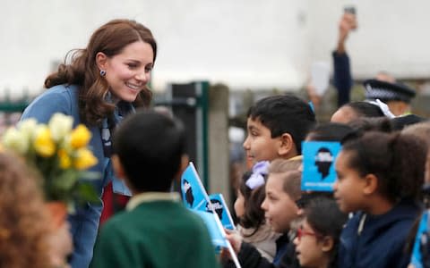 Duchess of Cambridge meets children from Roe Green Junior School in London - Credit: AP