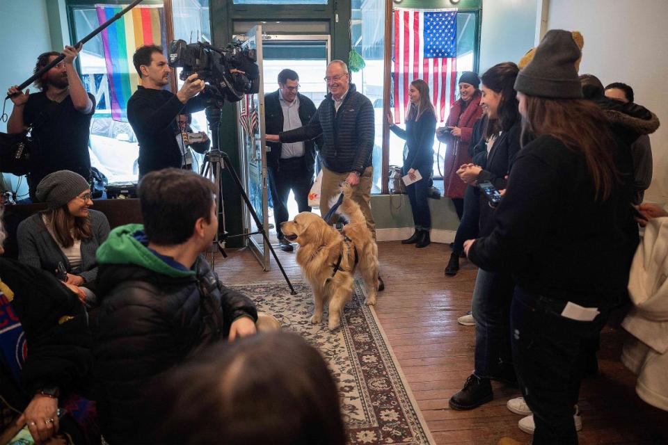 <div class="inline-image__caption"><p>Bailey Warren, Elizabeth Warren's golden retriever, led by her husband Bruce Mann and son Alex, arrive for a meet-and-greet at the Waterloo Field Office in Waterloo, Iowa.</p></div> <div class="inline-image__credit">Jim Watson/Getty</div>