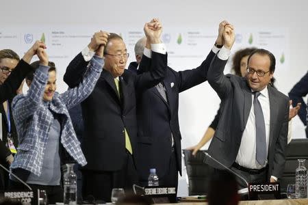 From L-R, Christiana Figueres, Executive Secretary of the UN Framework Convention on Climate Change, United Nations Secretary-General Ban Ki-moon, French Foreign Affairs Minister Laurent Fabius, President-designate of COP21 and French President Francois Hollande react during the final plenary session at the World Climate Change Conference 2015 (COP21) at Le Bourget, near Paris, France, December 12, 2015. REUTERS/Stephane Mahe