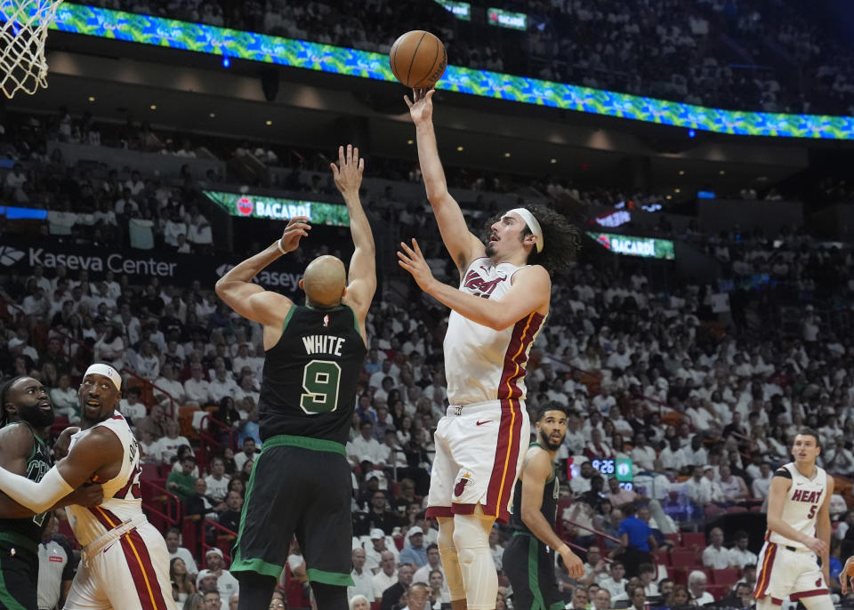 Miami Heat guard Jaime Jaquez Jr., center right, aims to score as Boston Celtics guard Derrick White (9) defends during the second half of Game 4 of an NBA basketball first-round playoff series, Monday, April 29, 2024, in Miami. (AP Photo/Marta Lavandier)