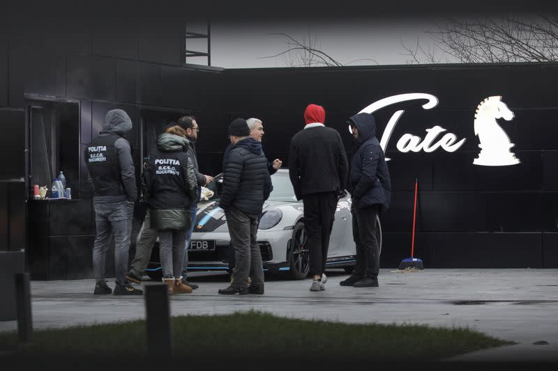 Romanian officials transport the cars seized from Andrew Tate's compound to a storage location