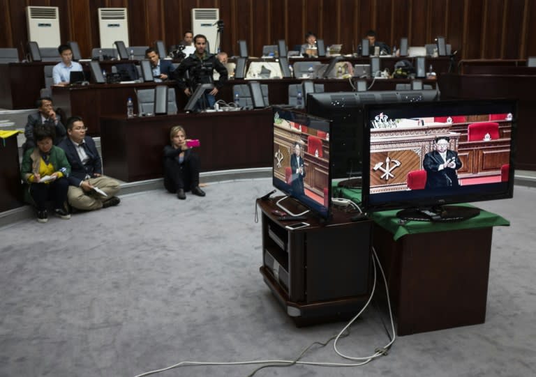 Journalists watch a television broadcast of a speech by North Korean leader Kim Jong-Un at the Workers Party Congress, in Pyongyang, on May 6, 2016