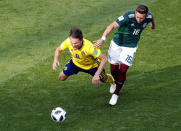 <p>Albin Ekdal goes to ground under pressure from Hector Herrera </p>