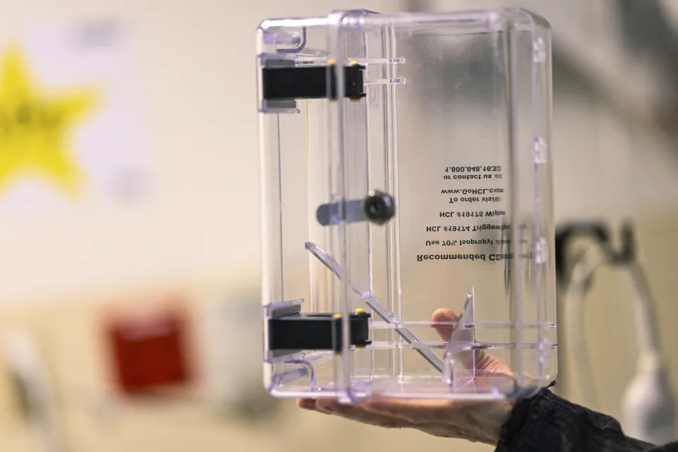 A lockbox is held to show where ketamine is placed into while administered at the Duke Speciality Infusion Center, Friday, Oct. 27, 2023, in Durham, N.C. Ketamine prescriptions have soared in recent years as an alternative to opioids for pain. But with little research on its effectiveness, some experts worry about the risks of overprescribing another powerful drug that carries risks of safety and abuse. (AP Photo/Matt Kelley)