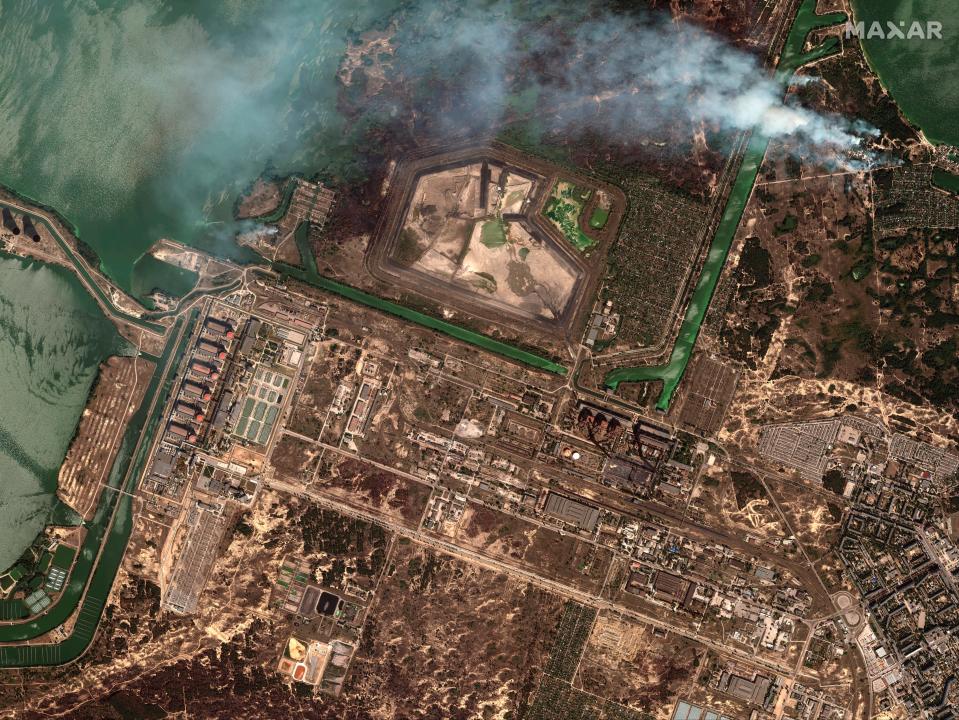 This satellite image provided by Maxar Technologies shows bush fires outside of the main power plant facilities at the Zaporizhzhya nuclear plant in Russian occupied Ukraine on Aug. 29, 2022.