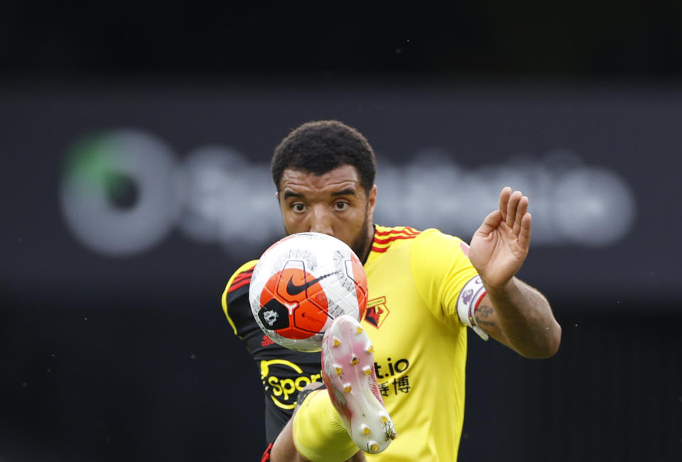 Watford's Troy Deeney kicks the ball during the English Premier League soccer match between Watford and Manchester City at the Vicarage Road Stadium in Watford, England, Tuesday, July 21, 2020. (John Sibley/Pool via AP)