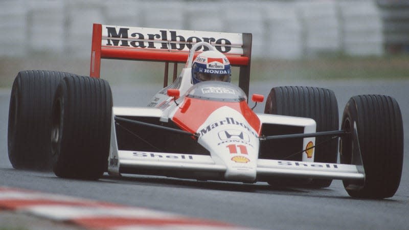 A photo of a McLaren MP4/4 race car on a track. 