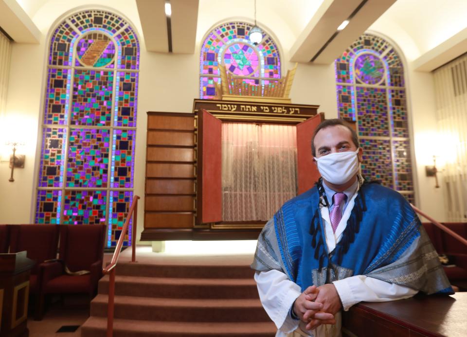 Rabbi Hillel Skolnik wears a prayer shawl, or "tallit," at the altar of the Congregation Tifereth Israel, 1354 E. Broad St. Skolnik said people visiting during the upcoming holidays must be vaccinated and wear masks. He said the tallit was a gift from his wife, Rabbi Sharon Barr Skolnik when they engaged in 2005.