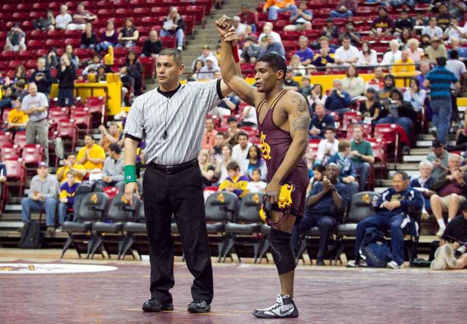 Wrestler Anthony Robles (right) at his winning match during the ASU vs. Cal State Bakersfield wrestling meet at Wells Fargo Arena in Tempe on Friday, January 21, 2011.