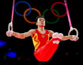 Weiyang Gao of China competes on the rings in the Artistic Gymnastics Men's Team final on Day 3 of the London 2012 Olympic Games at North Greenwich Arena on July 30, 2012 in London, England. (Photo by Ronald Martinez/Getty Images)