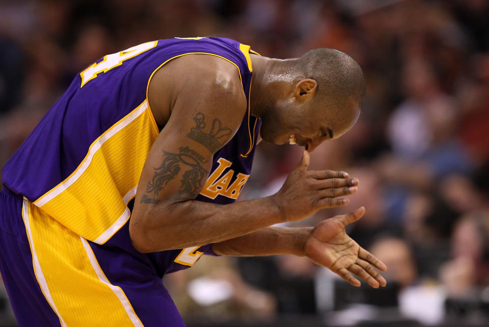 Lakers guard Kobe Bryant claps his hands after scoring against the Suns on Feb. 19 in Phoenix. (Photo by Christian Petersen/Getty Images)