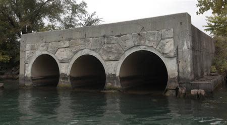 A view of the outfall pipes from The City of Detroit Water and Sewerage Wastewater Treatment Plant are seen along the Detroit River in Detroit, Michigan October 1, 2013. REUTERS/Rebecca Cook