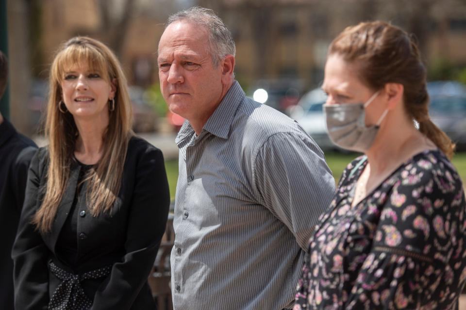 Karen Garner's daughter Allisa Swartz, right, son John Steward and daughter Monica Mitchell speak to reporters and community members outside the Larimer County Justice Center before the sentencing of former Loveland police officer Austin Hopp on Thursday.