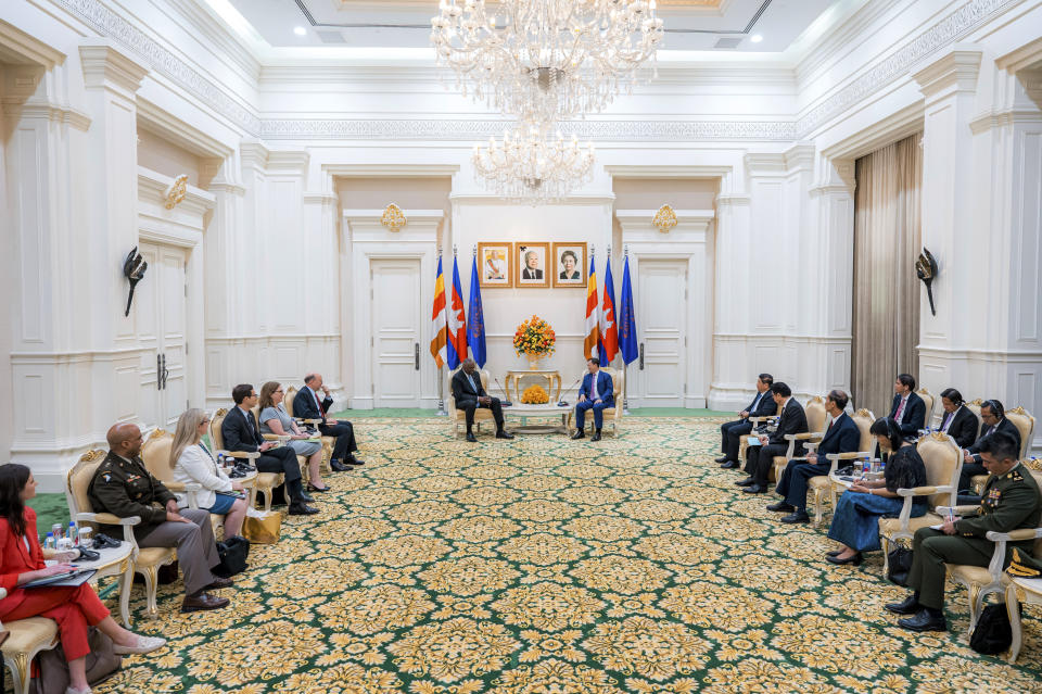 In this photo released by Agence Kampuchea Press (AKP), U.S. Defense Secretary Lloyd Austin, center left, talks with Cambodian Prime Minister Hun Manet, center right, during their meeting in Phnom Penh, Cambodia, Tuesday, June 4, 2024. Austin traveled to Cambodia on Tuesday to push for stronger military ties with China’s closest ally in Southeast Asia. (AKP via AP)