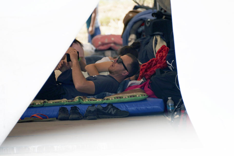 Ukrainian refugees rest at a camp in Utopia Park, Iztapalapa, Mexico City, Monday, May 2, 2022. (AP Photo/Marco Ugarte)