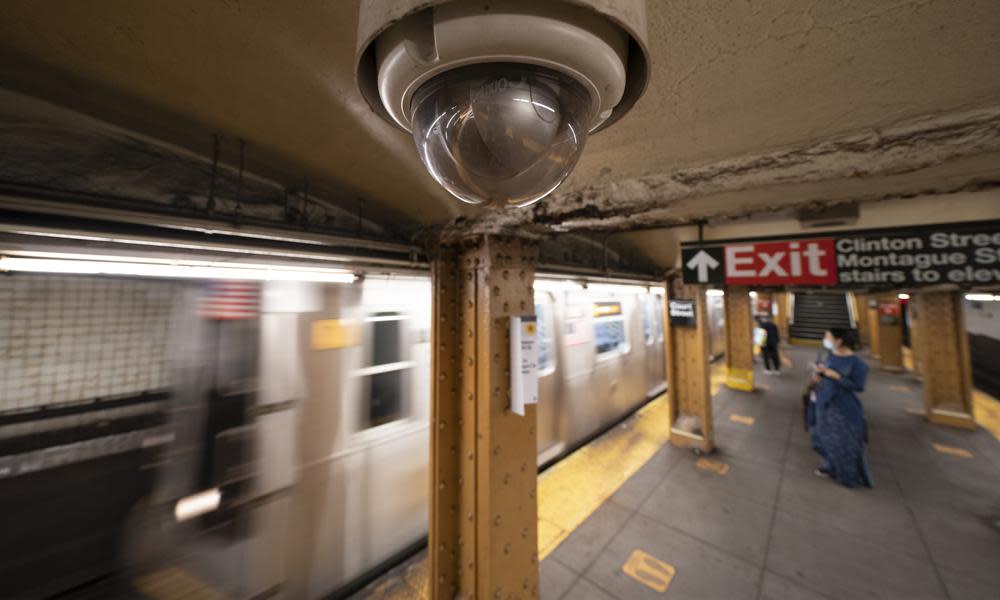 In this Oct. 7, 2020, file photo, a video surveillance camera is installed on the ceiling above a subway platform in the Court Street station in the Brooklyn borough of New York. (AP Photo/Mark Lennihan, File)