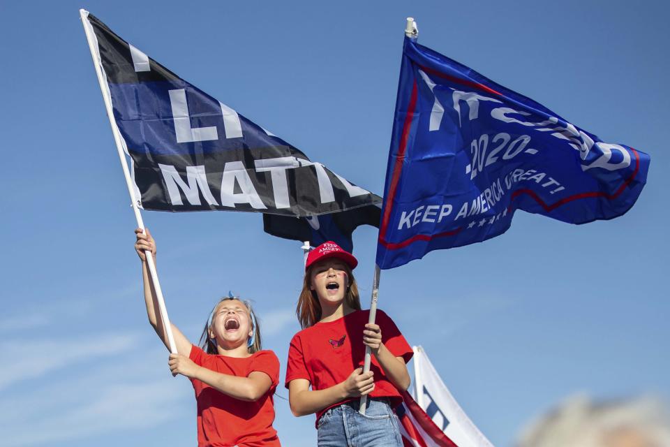 Trump supporters participate in a massive caravan that traveled through Portland, Ore., on Saturday afternoon Aug. 29, 2020. In the course of the demonstration, one man was shot and killed in downtown Portland. (Mark Graves/The Oregonian via AP)