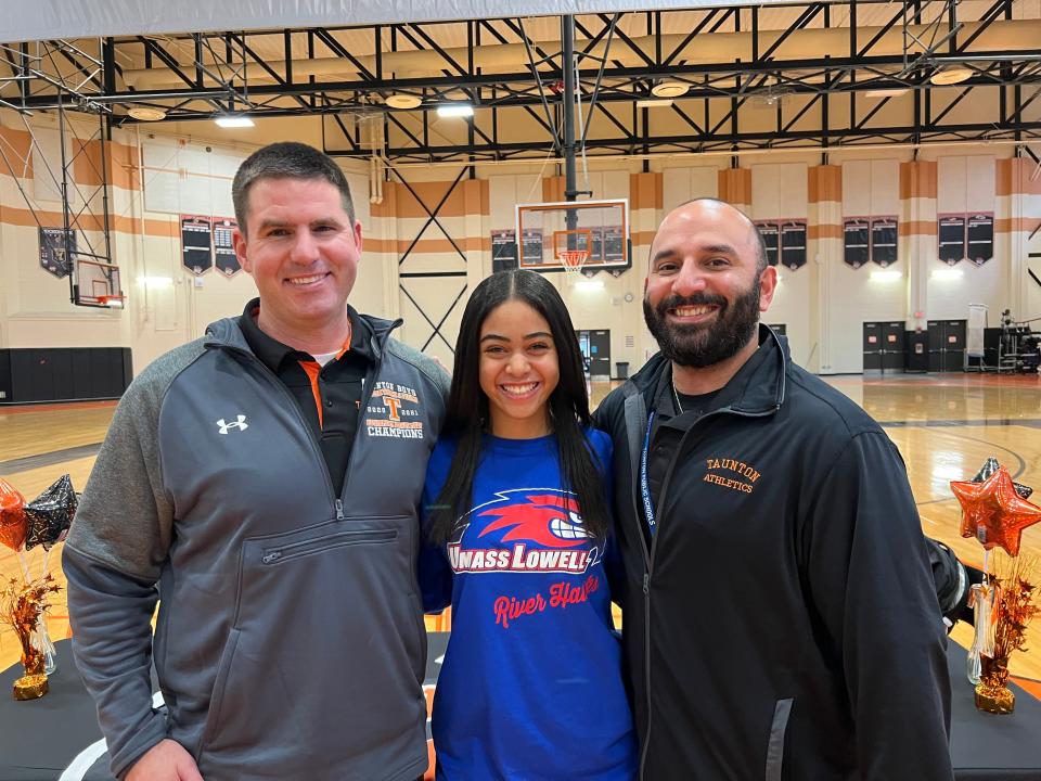 Taunton's Nia Mainer-Smith (center) with former Taunton track coaches Jeff Moore (left) and Jason Torres (right).