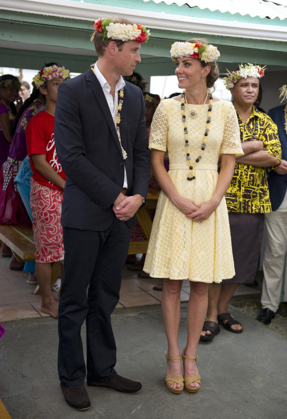 <p>The Duchess spent a day in the Solomon Islands in a primrose yellow dress featuring a broderie anglaise design. She teamed the look with Stuart Weitzman wedges.</p><p><i>[Photo: PA]</i></p>