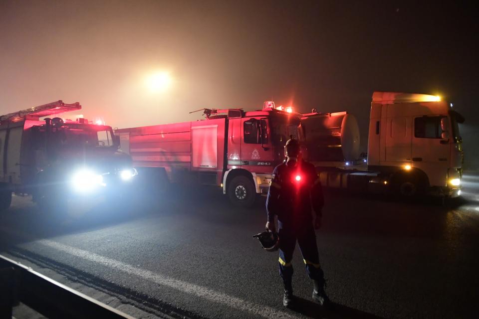 Fire trucks operate during a wildfire in Afidnes area, northern Athens, Greece, Thursday, Aug. 5, 2021.Wildfires rekindled outside Athens and forced more evacuations around southern Greece Thursday as weather conditions worsened and firefighters in a round-the-clock battle stopped the flames just outside the birthplace of the ancient Olympics. (AP Photo/Michael Varaklas)