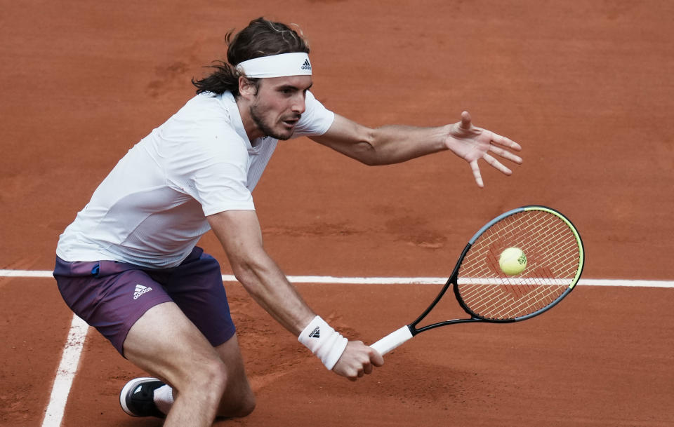 Stefanos Tsitsipas of Greece plays a return to Spain's Pablo Carreno Busta during their fourth round match on day 8, of the French Open tennis tournament at Roland Garros in Paris, France, Sunday, June 6, 2021. (AP Photo/Thibault Camus)