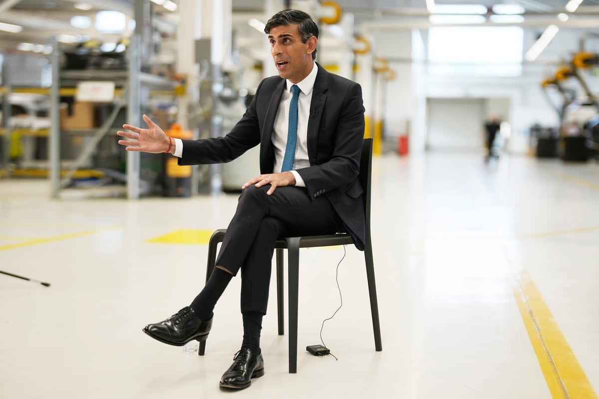 Sunak and his ankle swingers at a battery factory in July (Getty)